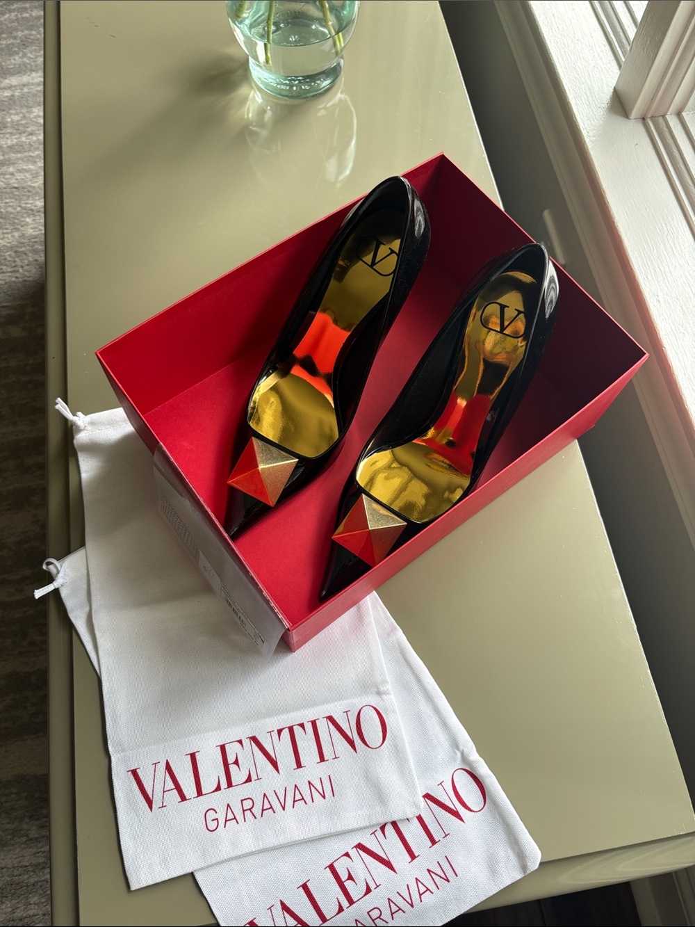 Valentino Garavani Black Patent Pointed Toe Heels with Red Pyramid Accent